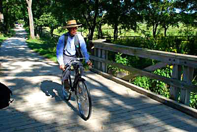 Kline Creek Farm Employee on Bike Trail